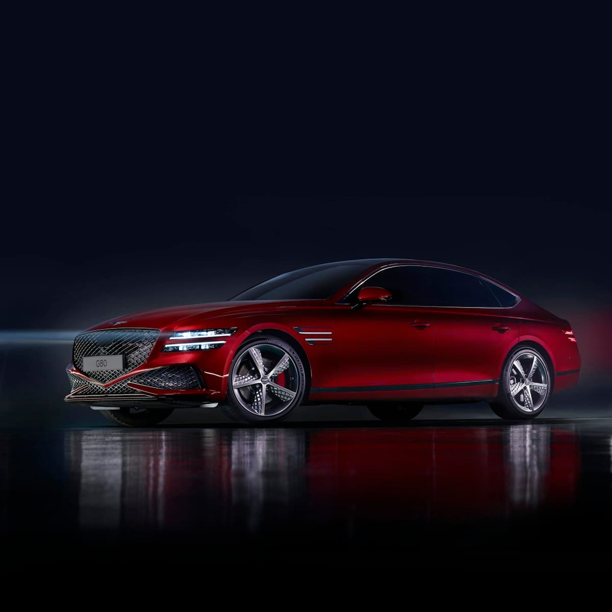 Luxury sedan in a dark studio with reflections