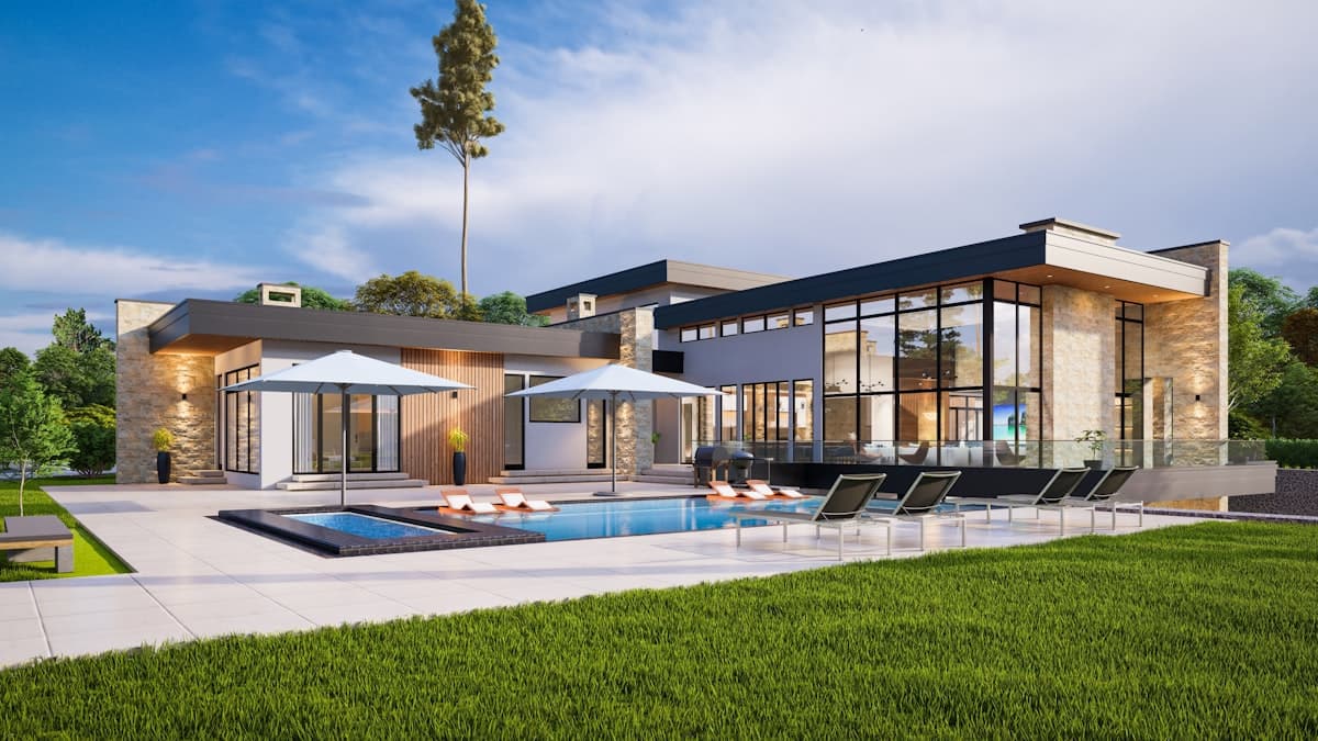 Modern luxury home with pool at dusk