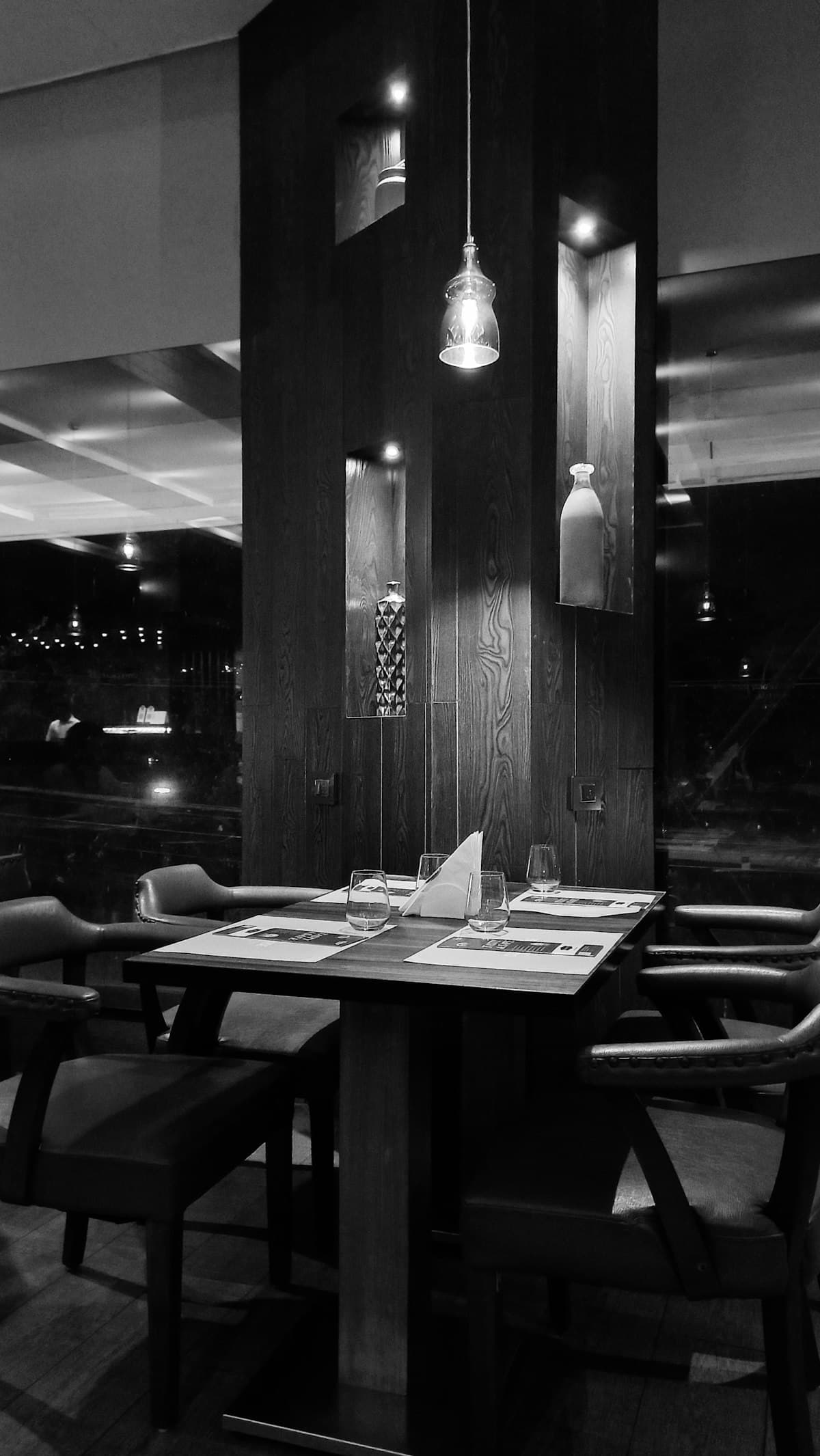 Moody fine-dining table setting by a window